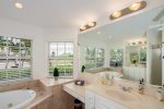 The Master Bathroom features dual sinks, jetted tub and walk in shower